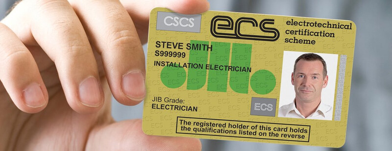 A hand holding up a sample ECS card