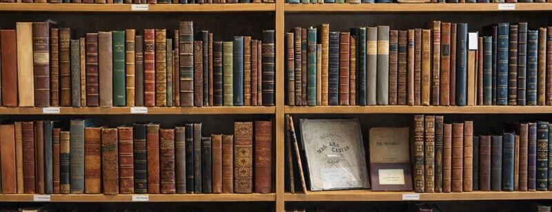 Shelves of leather-bound books