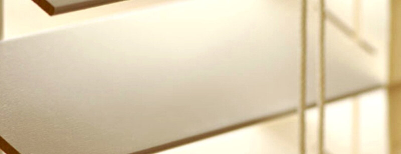 A close-up of wooden blind slats