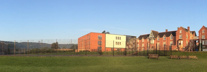 The Gildredge House school buildings seen across the playing field