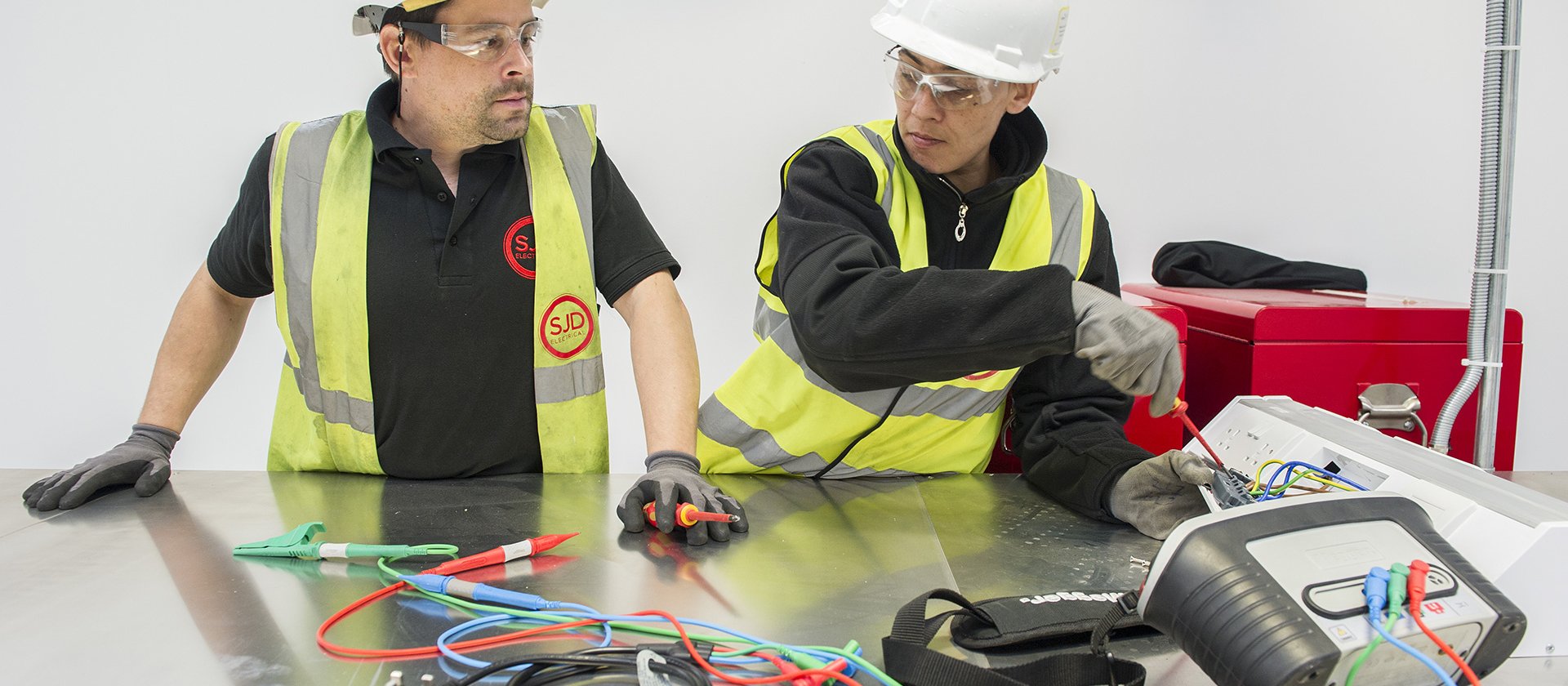 Two electricians testing an installation, a photo from The ESP website
